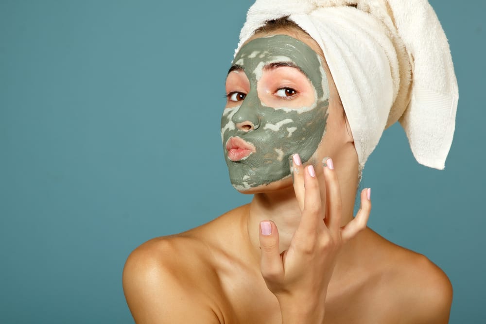 Girl putting on face mask