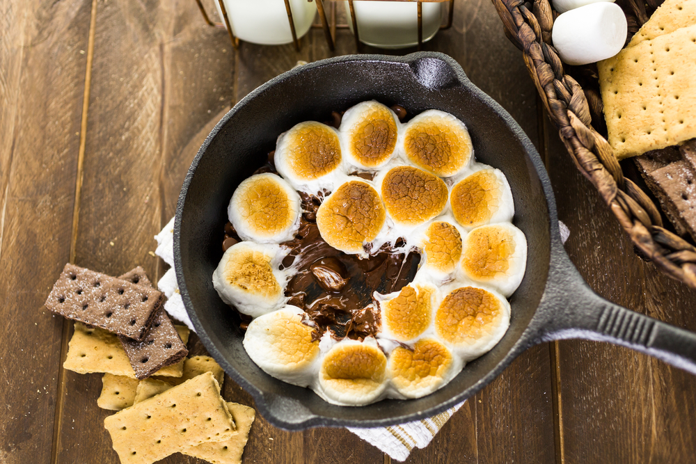 FCOM - Smores dip prepared with large marshmallows in cast iron pan